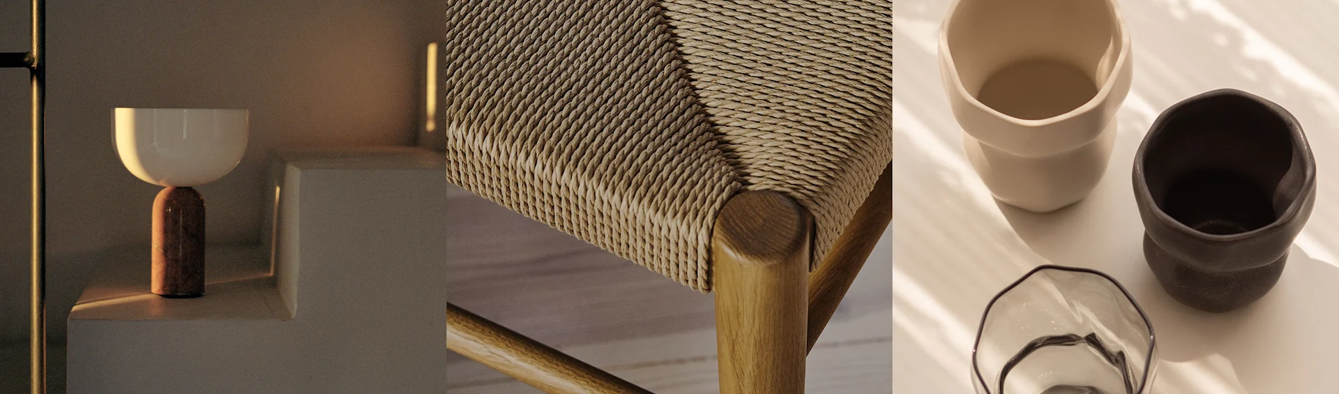 Moderni lamppu, punottu tuolin istuin ja kaksi keraamista mukia lasikulholla, kaikki lämpimissä sävyissä.